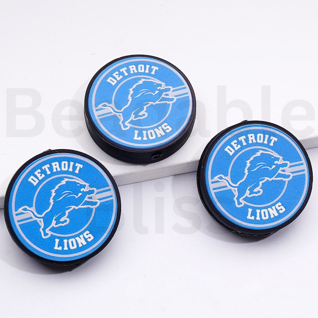 Three Detroit Lions logo buttons on a white background