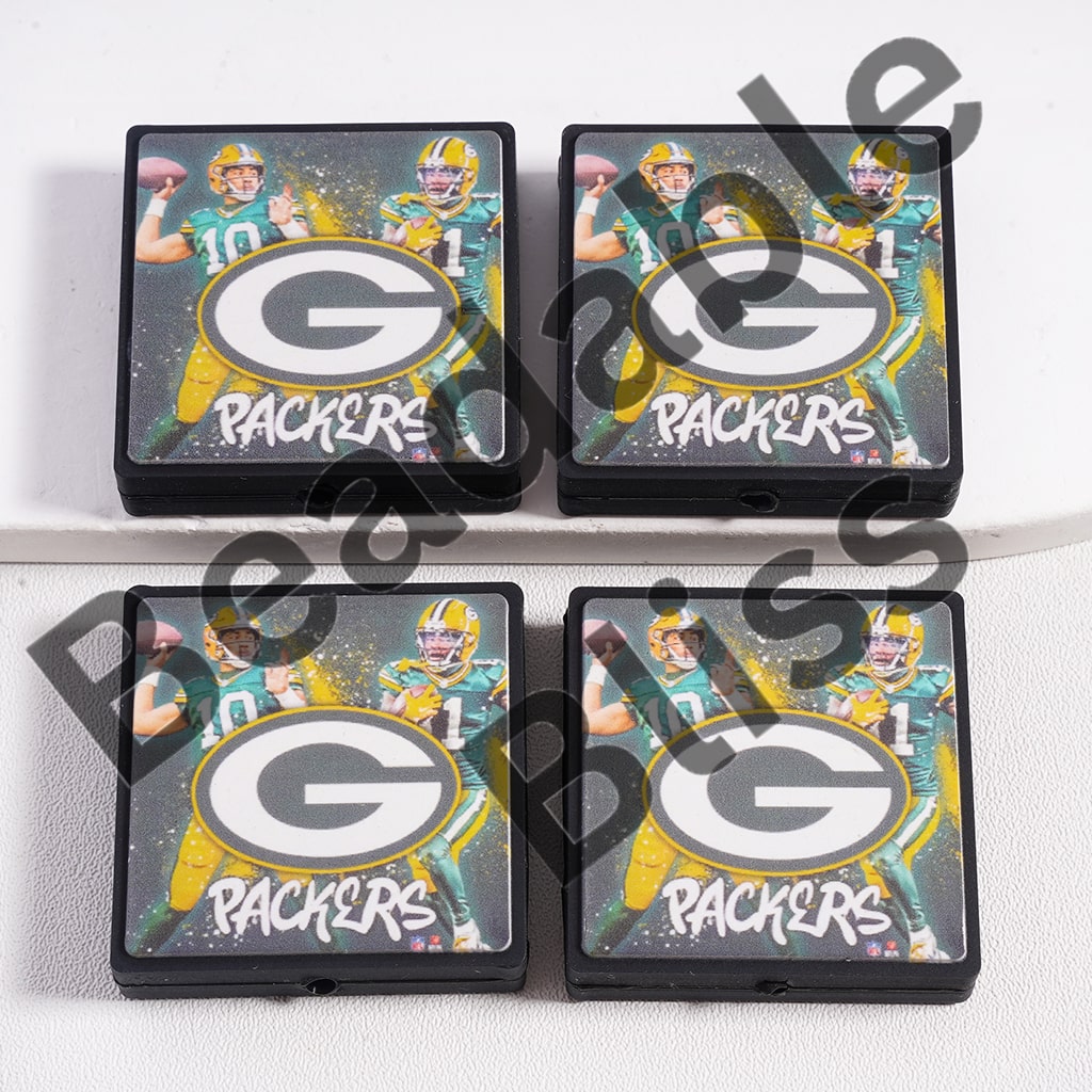 Four Green Bay Packers coasters with a player holding a football on a white background.
