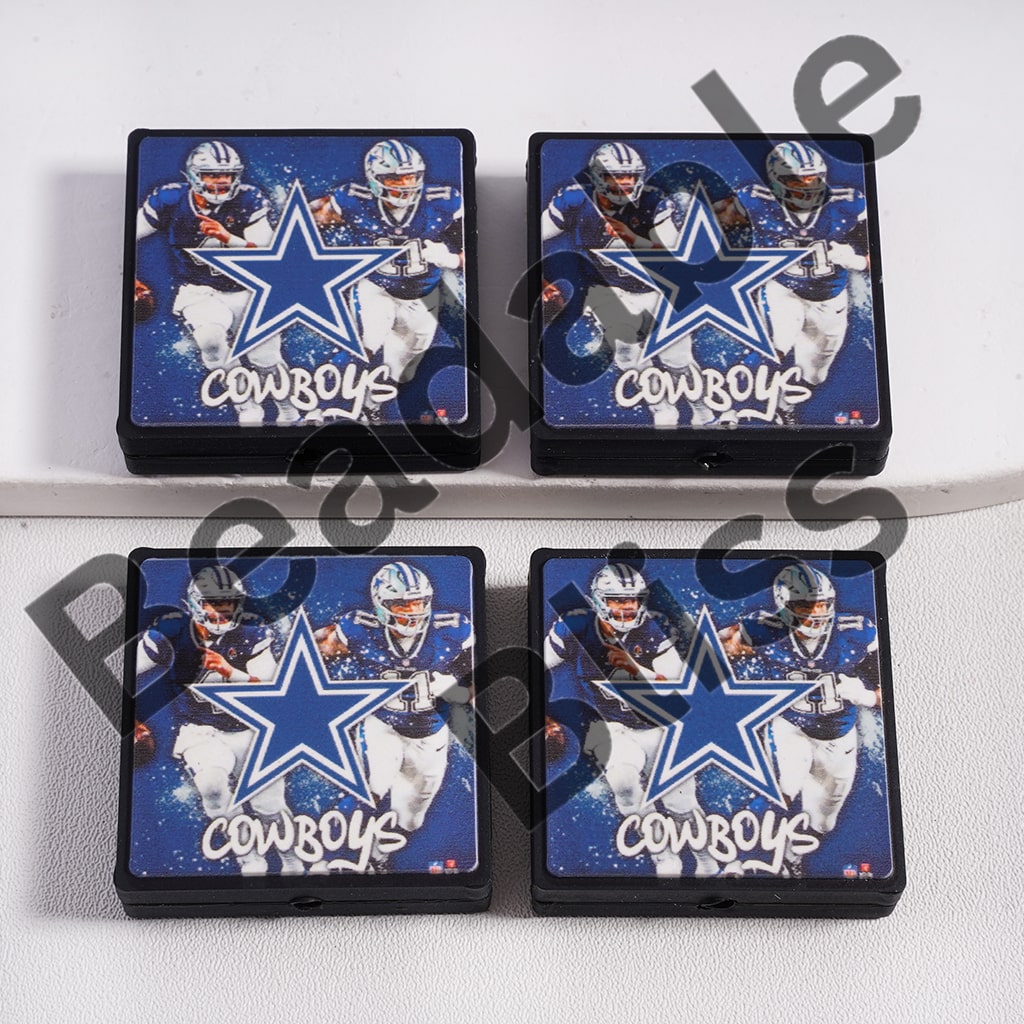 Four Dallas Cowboys-themed coasters on a white surface