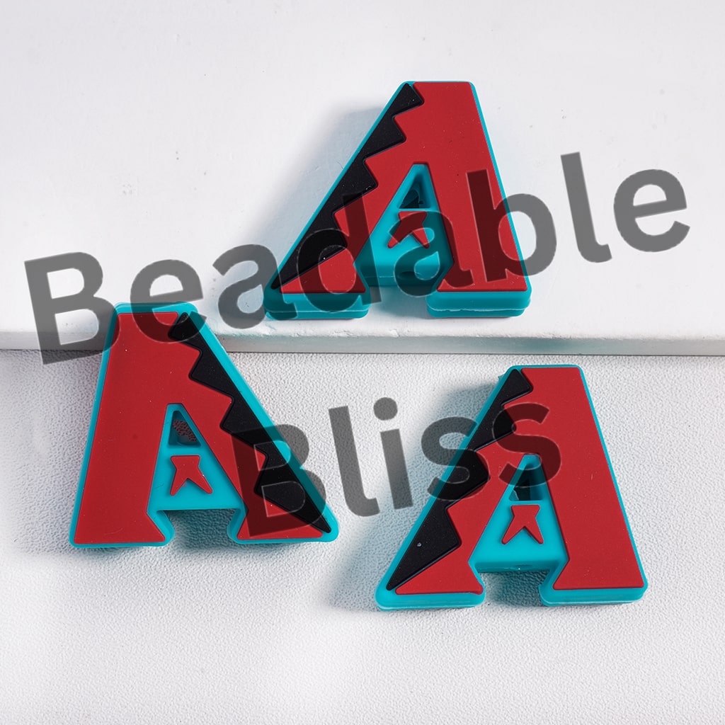Three red and blue geometric earrings on a white background with 'beadablebliss' text.
