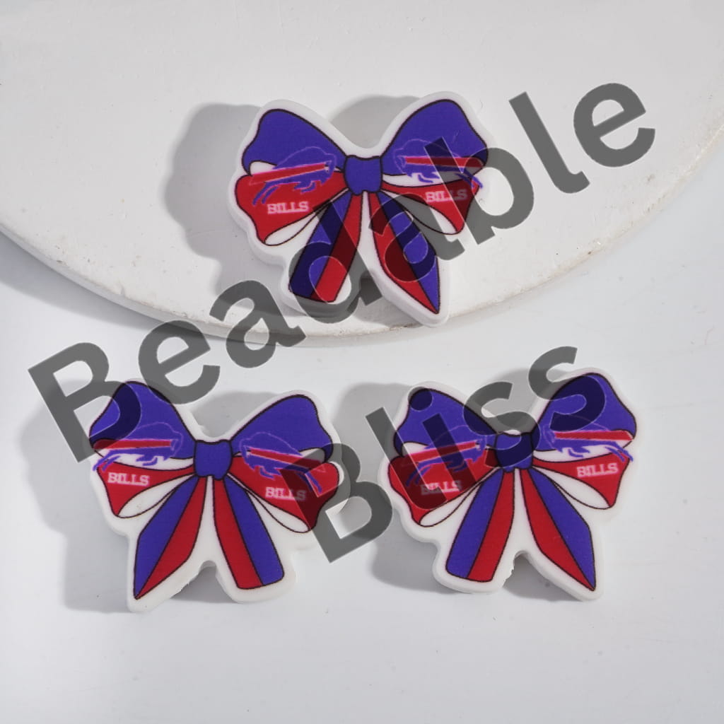 Three decorative bows with red and blue ribbons on a white background, branded 'handsontosupply'.