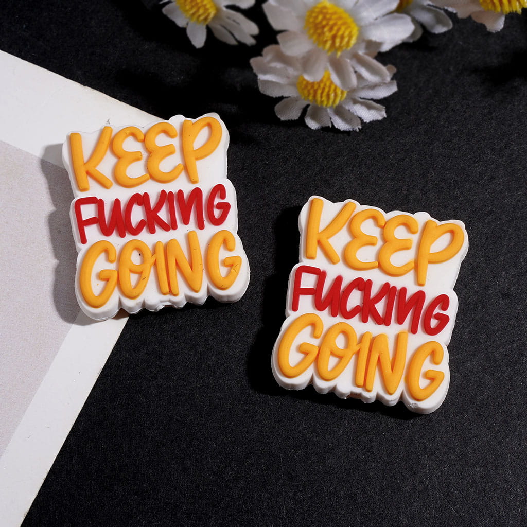 Silicone Focal Beads with Yellow and Red Text "Keep Humor Going"