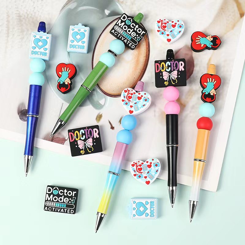 Colorful pens and decorative items with 'Doctor' theme on a light background