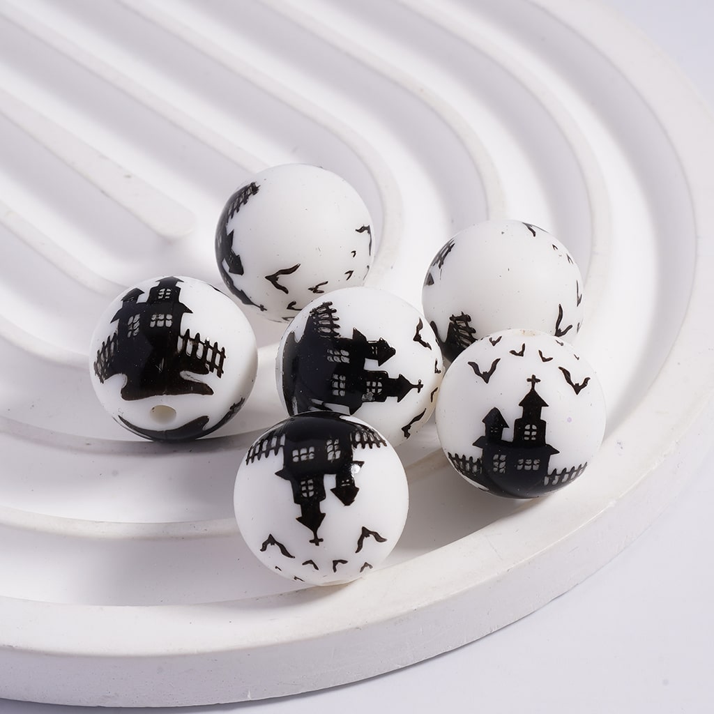 White balls with black architectural designs on a white background