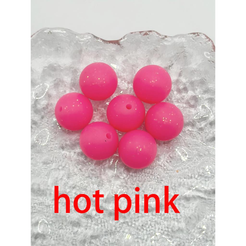 Hot pink beads on a textured white background with 'hot pink' text.