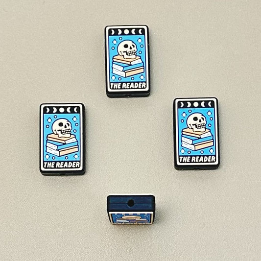 The Reader A Bone Figure Skeleton Head on Books Silicone Focal Beads