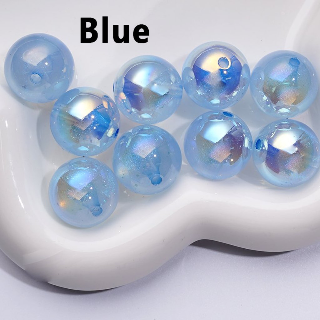 A collection of round acrylic beads with a 20MM size, featuring a luminous glitter galaxy finish in various colors.