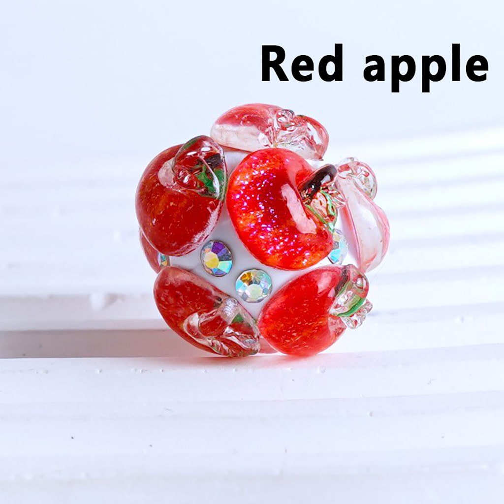 Decorative item resembling red apples with a white background