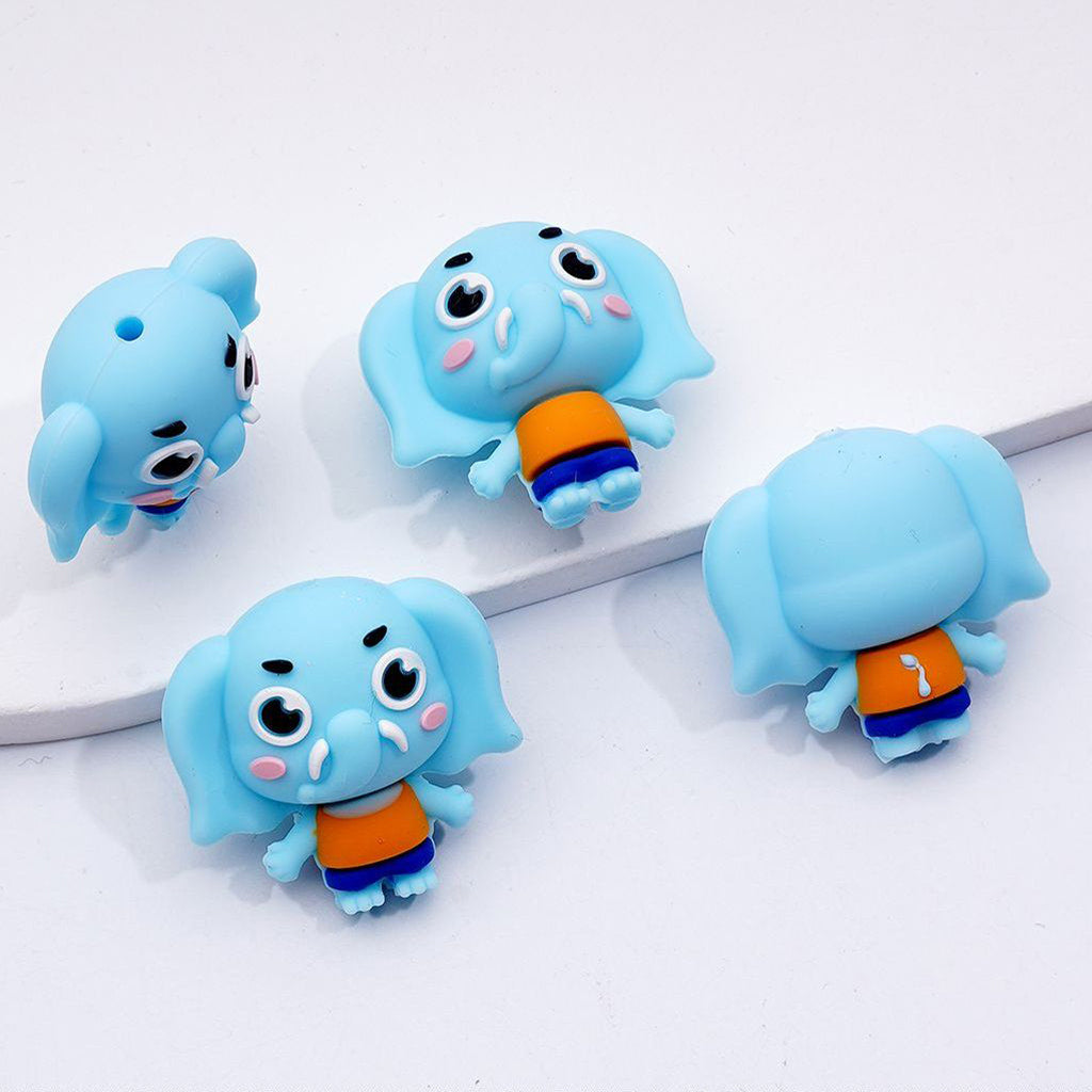 Four blue cartoon elephant figurines with orange shirts on a white background