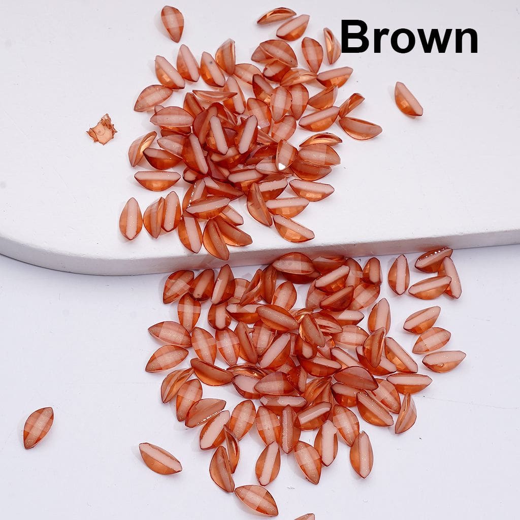 Brown seeds scattered on a white surface with 'Brown' text above.