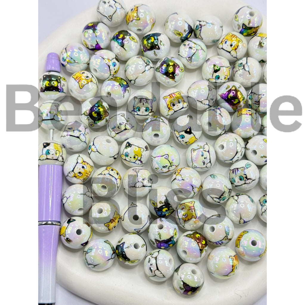 White beads with colorful designs on a white surface