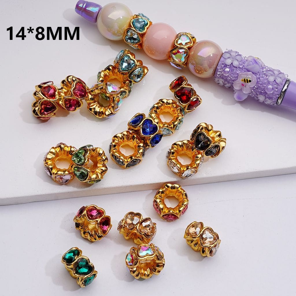 Gold and multicolored gemstone beads on a white surface with text '14*8MM'.