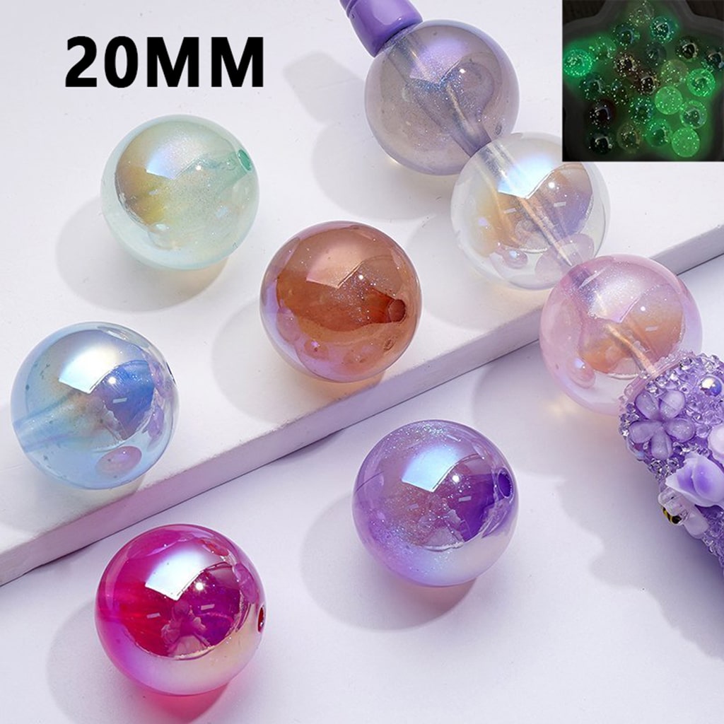 A collection of round acrylic beads with a 20MM size, featuring a luminous glitter galaxy finish in various colors.

