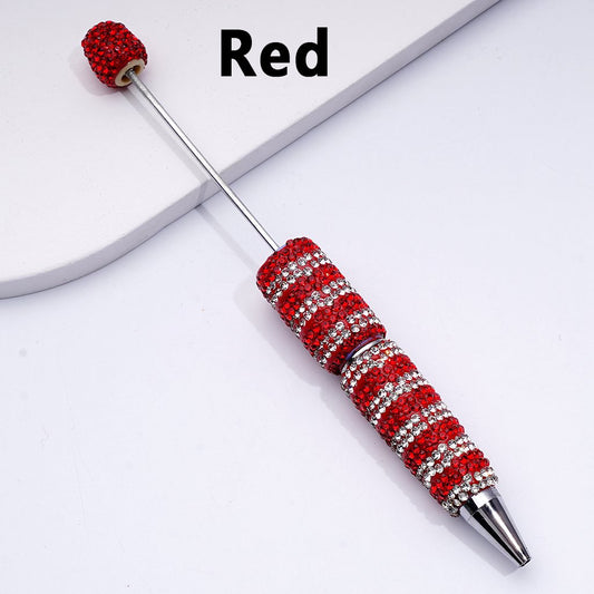 Decorative pen with red and silver design on a white background

