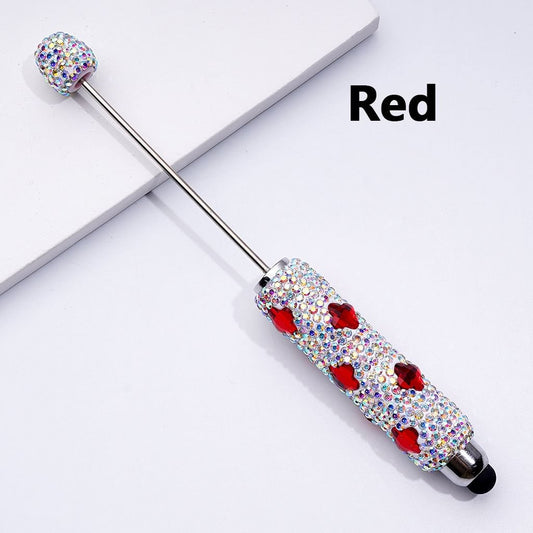 A selection of beadable clay stylus pens adorned with vibrant four-petal flowers and dazzling AB rhinestones, displayed on a white background.

