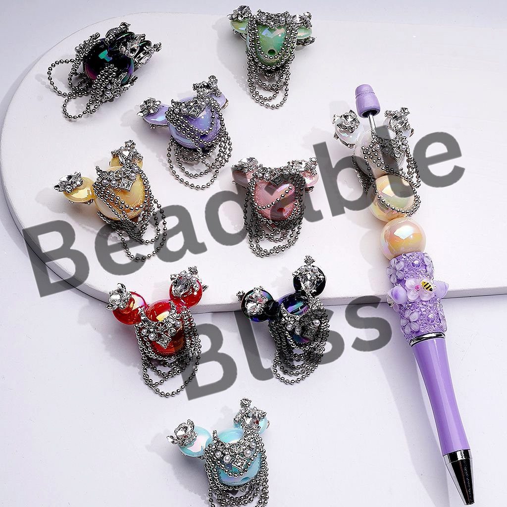 Decorative hair clips and a pen on a white background with 'hairalso supply.' branding.