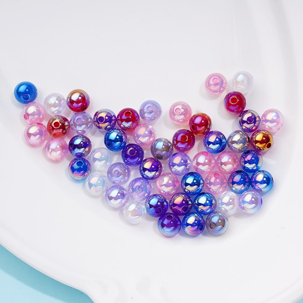 Colorful iridescent beads on a white background