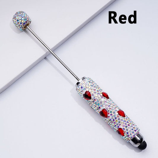 A collection of mini stylus pens with colorful heart-shaped rhinestones and beadable clay covering the pens' bodies.

