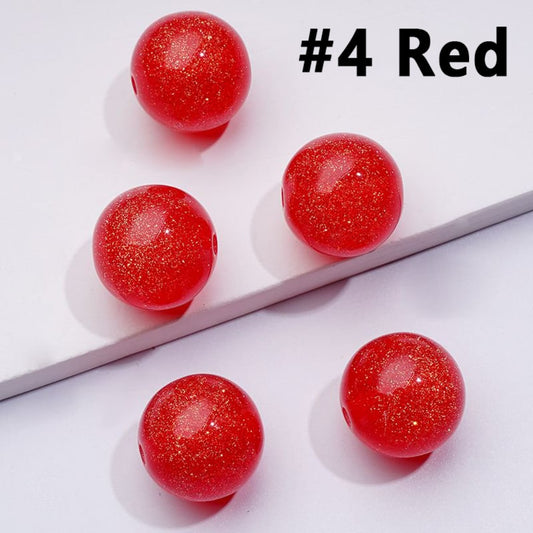 A collection of colorful, glossy round acrylic beads in various colors including blue, pink, purple, red, green, black, and silver, with a measurement marking of 16mm.

