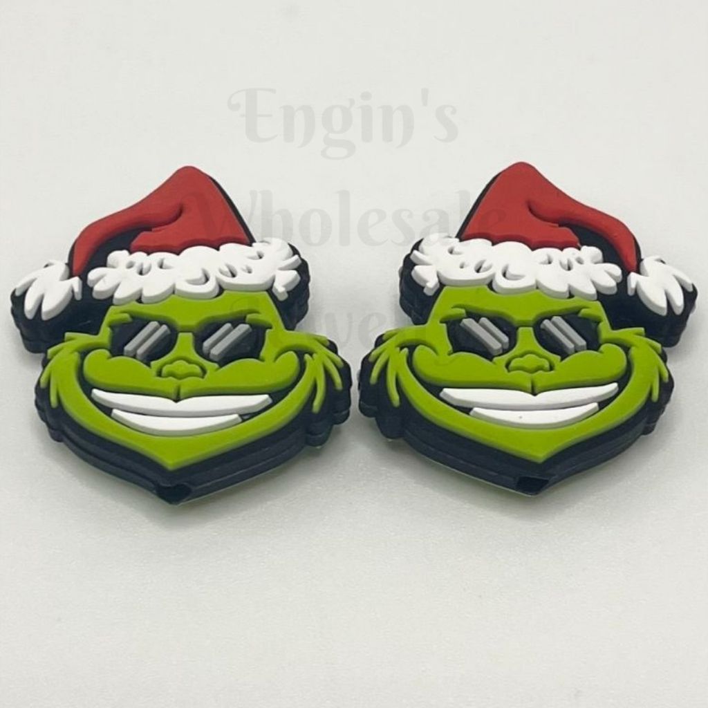赤いクリスマス帽子のシリコーン焦点ビーズと漫画の緑のモンスター
