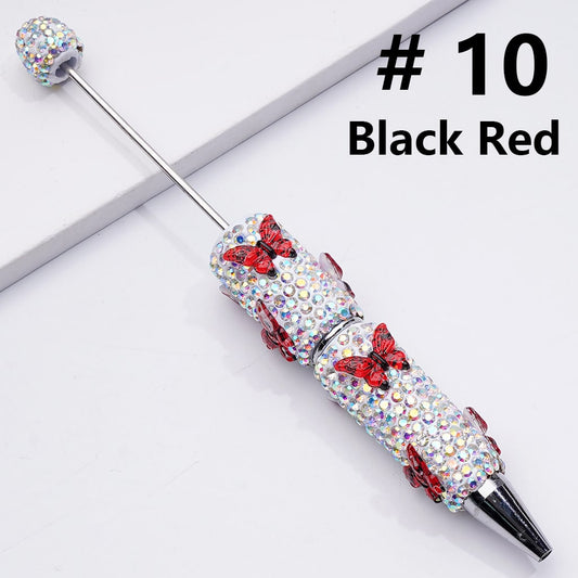 Decorative pen with gemstones and red accents on a white background, labeled '#10 Black Red'.