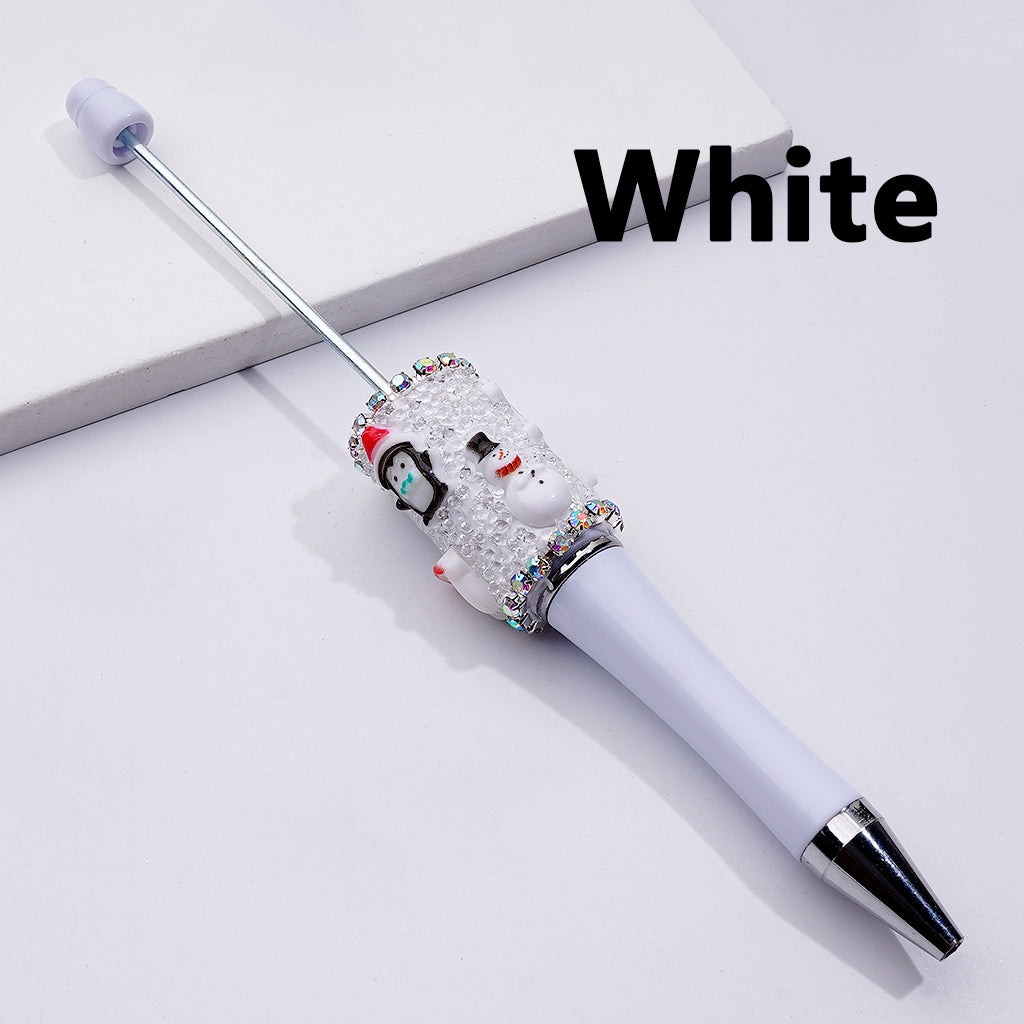 White pen with decorative snowman design on a light gray background

