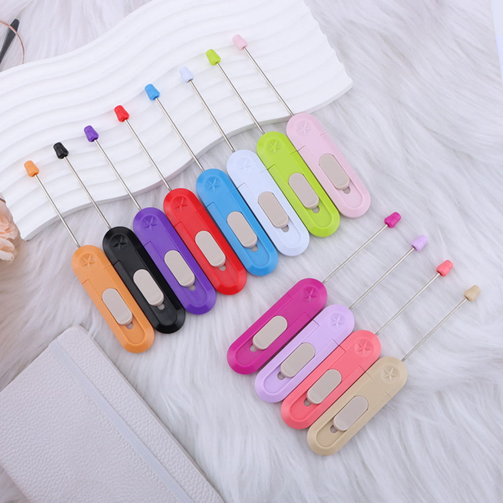Set of colorful sewing needles on a white background