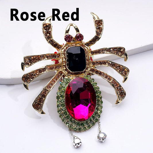 Spider-shaped brooch with gemstones on a white background, labeled 'Rose Red'.

