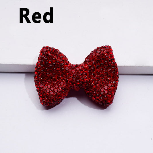 Red rhinestone bow on a white background

