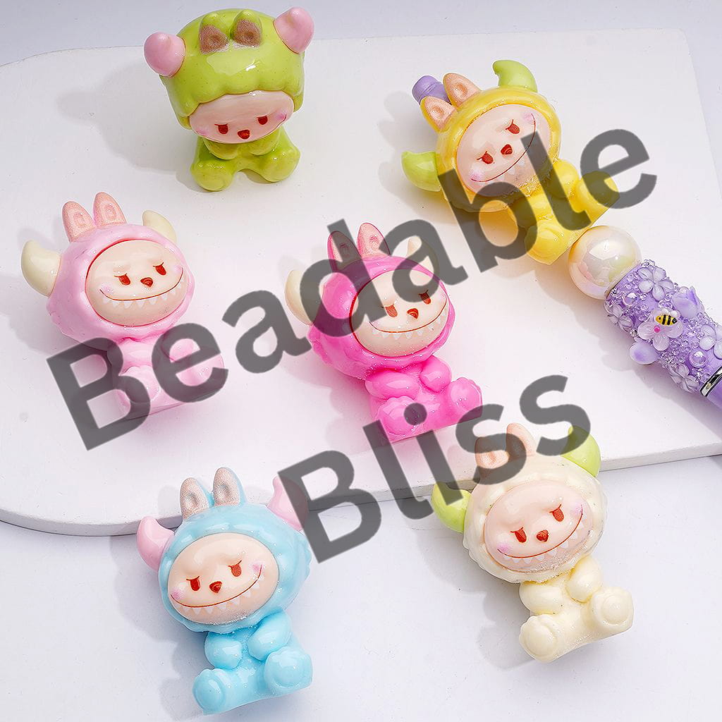 Set of colorful animal-themed keychains on a white surface with 'handsontoy.com' branding.