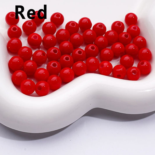 Red beads in a white dish with 'Red' text above.


