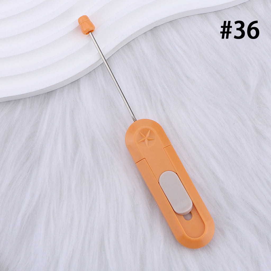 Orange handheld milk frother on a white background with the number 36.
