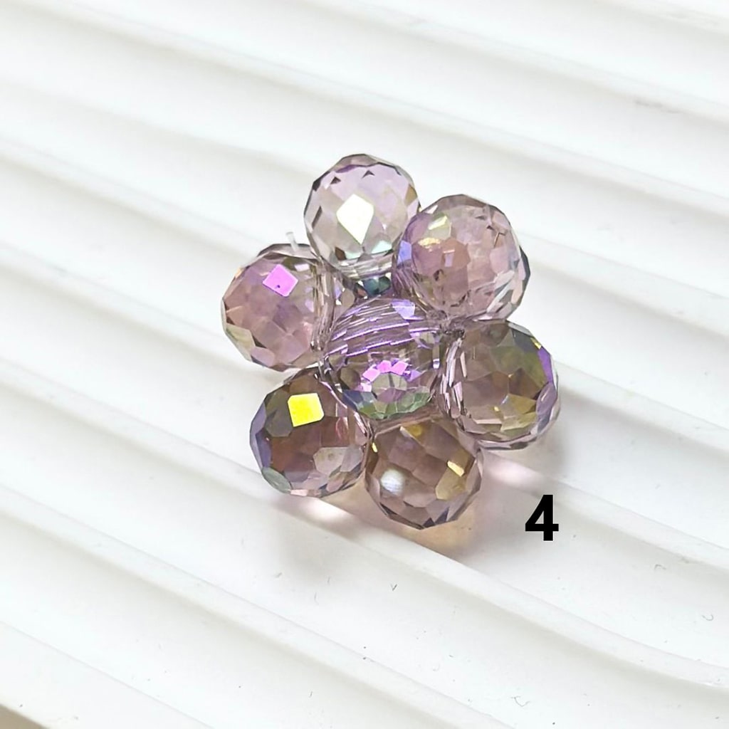 Multicolored faceted beads on a white background

