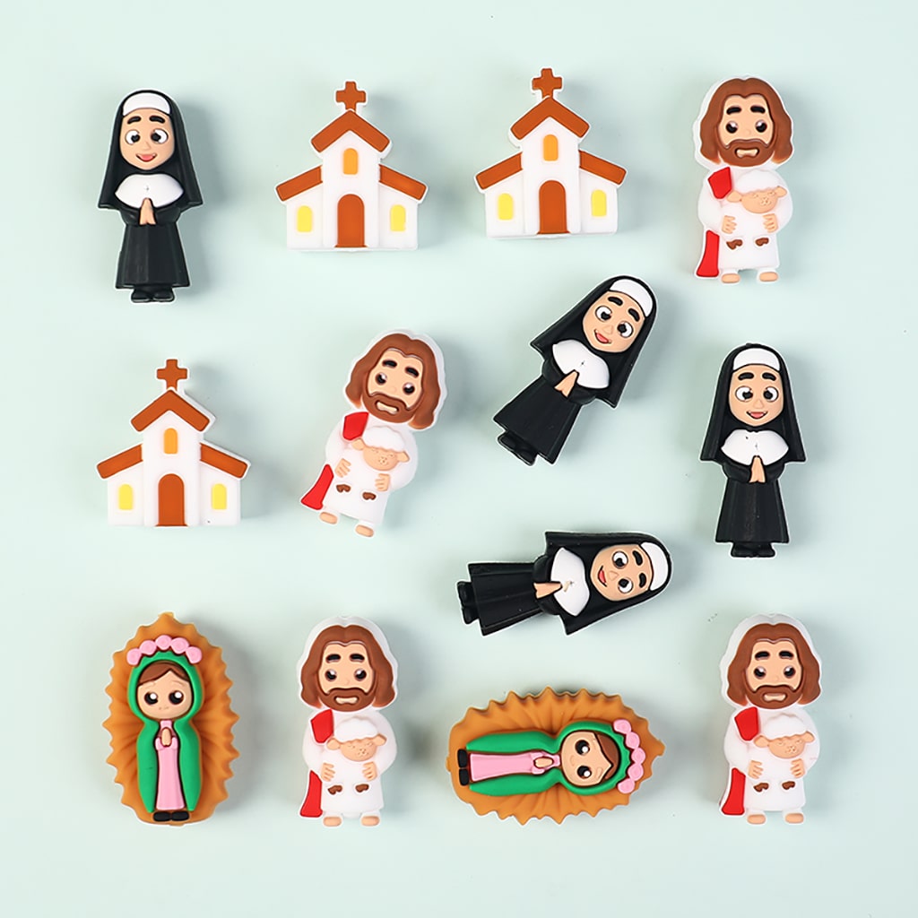 Set of religious-themed figurines including nuns, Jesus, and Mary on a light blue background.
