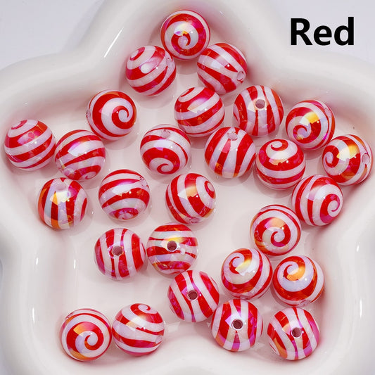 Red and white striped beads on a white background

