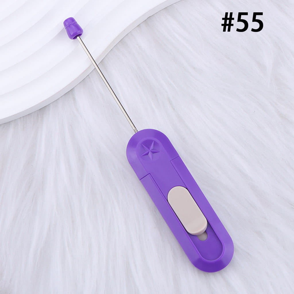 Purple fabric marker with a white button on a white background