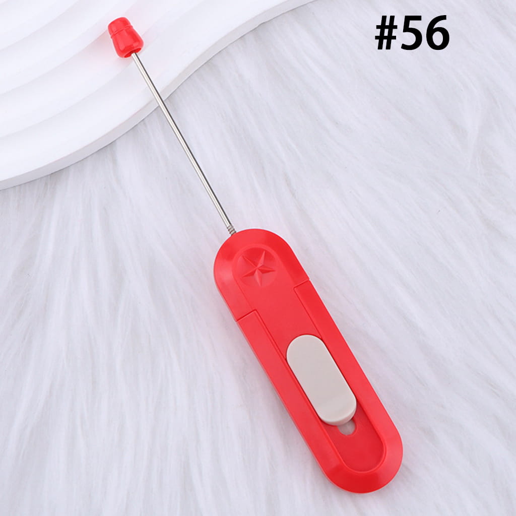 Red handheld tool with a white button on a white background