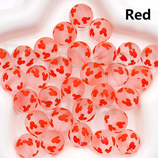 Pink beads with red spots on a white background, labeled 'Red'.

