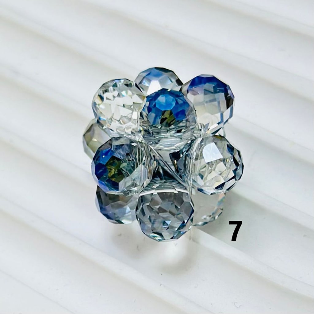 Blue crystal flower brooch on a white background

