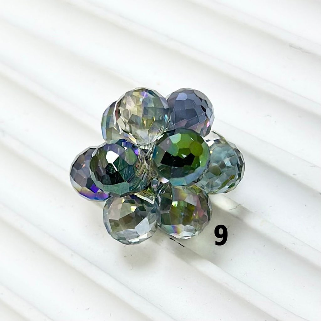 Multicolored faceted beads on a white background

