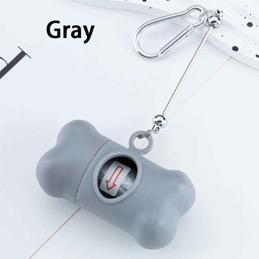 Gray bone-shaped keychain with a bell on a white background
