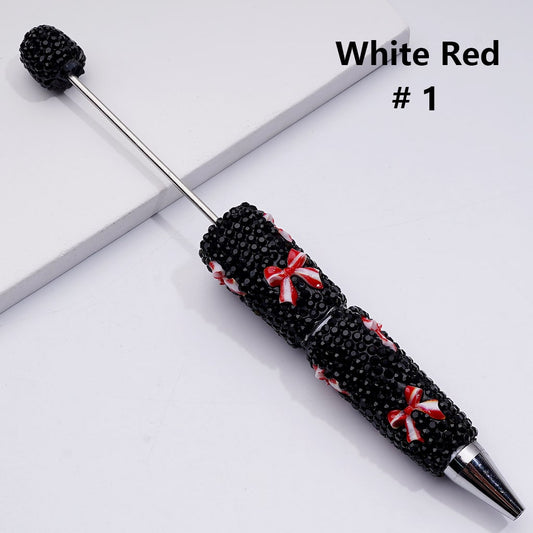 Decorative pen with black and red design on a white background

