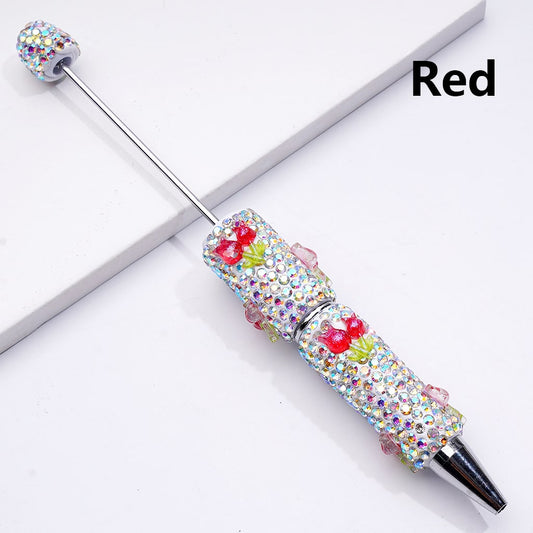 Decorative pen with gemstones on a white background

