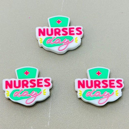 Silicone beads with 'Nurses Day' text and a nursing cap symbol in green and pink colors.

