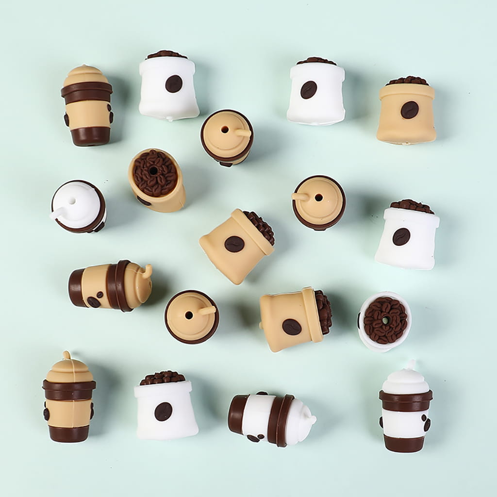 Collection of coffee-themed chocolate candies on a light blue background