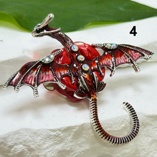 A collection of alloy dragon figurines in various colors, adorned with colorful mini AB rhinestones, white pearls, and other decorative elements.

