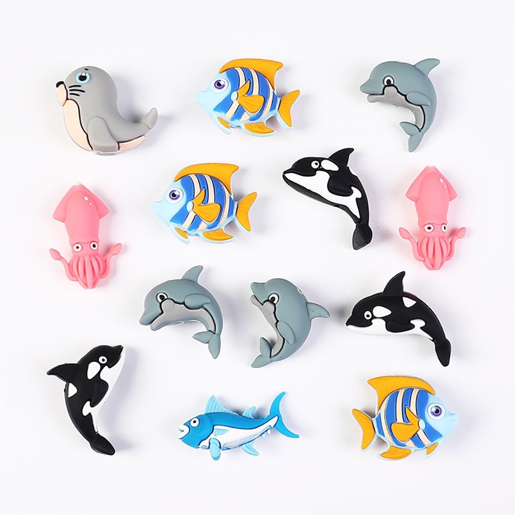 Set of colorful sea animal figurines on a white background