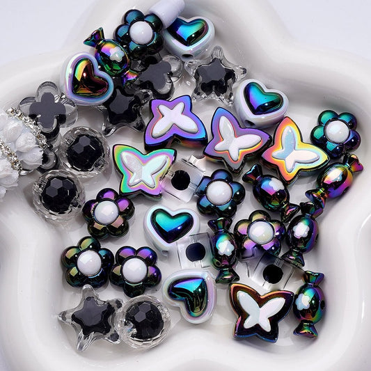 Assorted colorful jewelry charms on a white background

