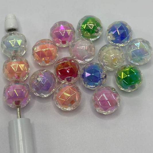 Set of colorful faceted beads on a white background

