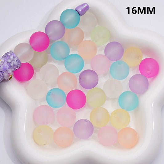Pastel-colored water beads on a white plate with '16MM' text.

